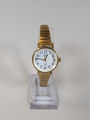 Timex Indiglo white dial with black numerals and gold case and band