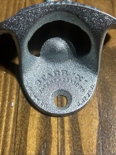 Corona Extra, Starr "X", blue raised letters, Wall mount, bottle opener