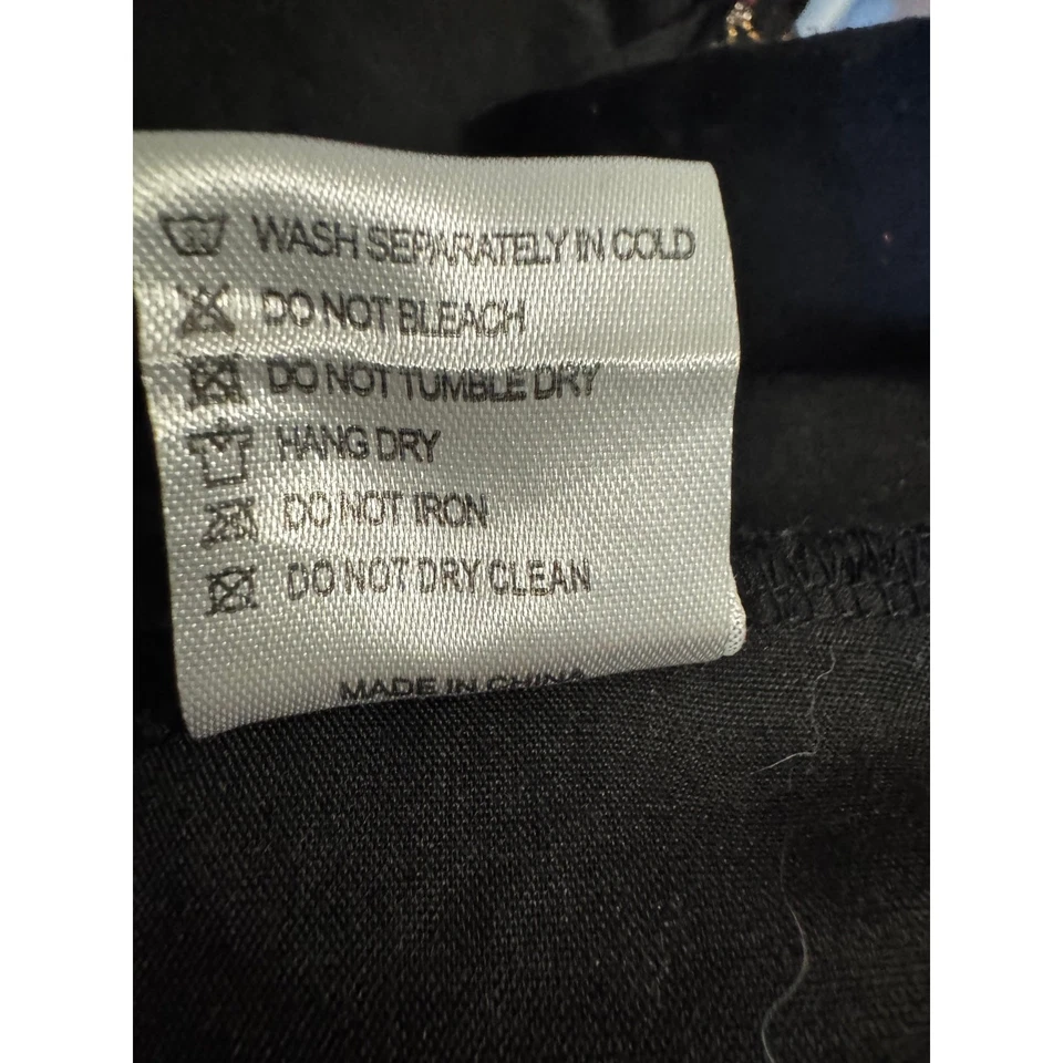 Vestido de fiesta LOLA + THE BOYS para niñas con lentejuelas fondo negro estrellas multicolores (8) Foto 4 de 4