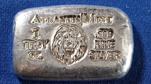 A Atlantis Mint LION- 1 oz .999 Fine Silver Hand Poured Bar