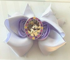 Beautiful Lavender Fancy Nancy inspired hair bow for girls.