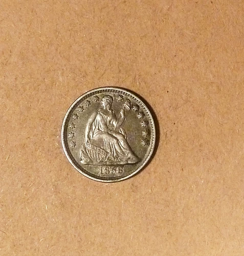 1858 Liberty Seated Half Dime, grades AU+, Scarce, 'Leather Purse Coloring'.