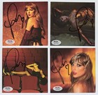 SIGNED TAYLOR SWIFT LIFE OF A SHOWGIRL CD PHOTO SET ALL 4 PSA DNA COA AUTOGRAPH