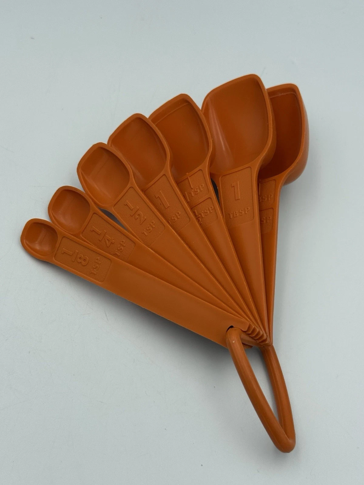 Vintage Tupperware Measuring Spoon Set of 7 w/D Ring Orange Retro NOS
Opens in a new window or tab