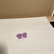 Purple, resin dogs sitting position ￼