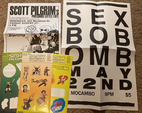 Scott Pilgrim 20th Anniversary Box Set items - posters and stickers