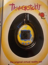 NEW SEALED Tamagotchi 1997 Yellow / Blue Logo