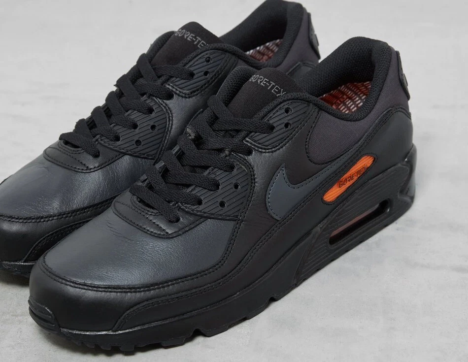 Nike black and orange cheap trainers