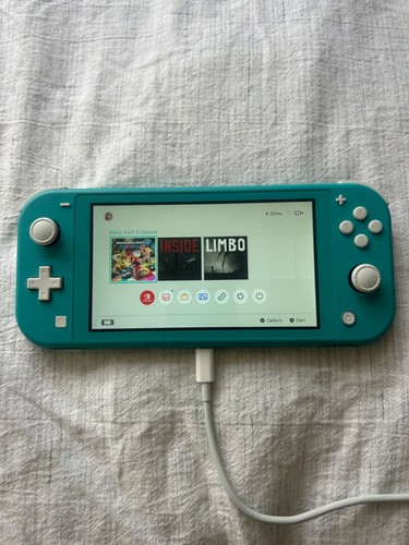 Lightly used Nintendo Switch Lite Console with Games- turquoise