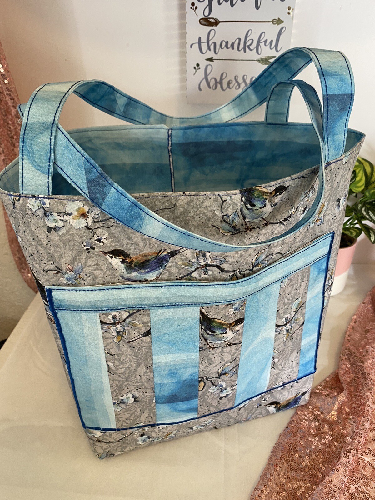 Handbag, light blue and gray in color spacious large bag.-image