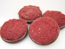 Four round vintage pressed metal castor furniture cups                        E6