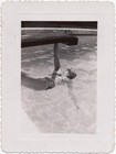 Woman hanging off diving board, 1940s — photo 1