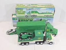 Vintage BP Transforming Truck And Race Car Carrier Lot Of 2 Toy Trucks