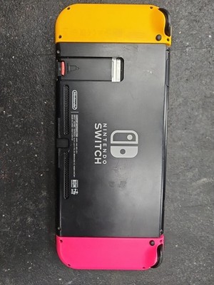 Nintendo Switch gaming console with neon pink and yellow Joy-Con