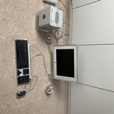 Apple Power Mac G4 Cube with Studio Display, speakers, keyboard and mouse