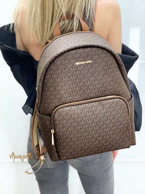 white and brown backpack