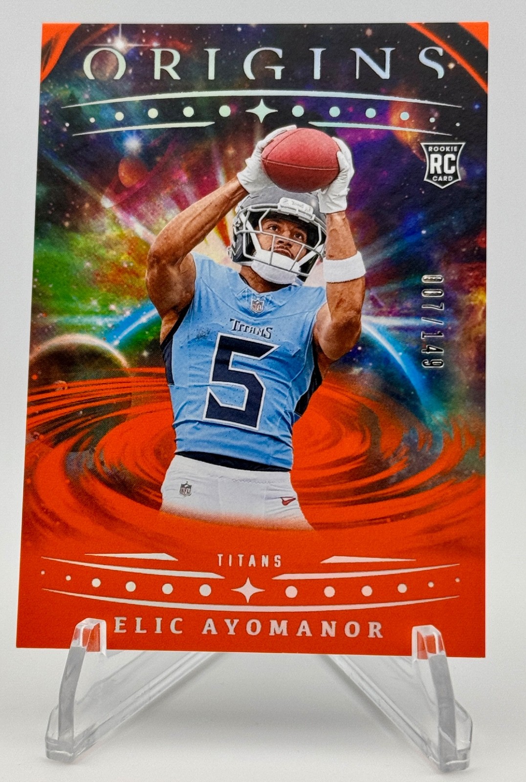 2025 Panini Origins Elic Ayomanor #108 (RC) Rookie Orange 007/149 TITANS