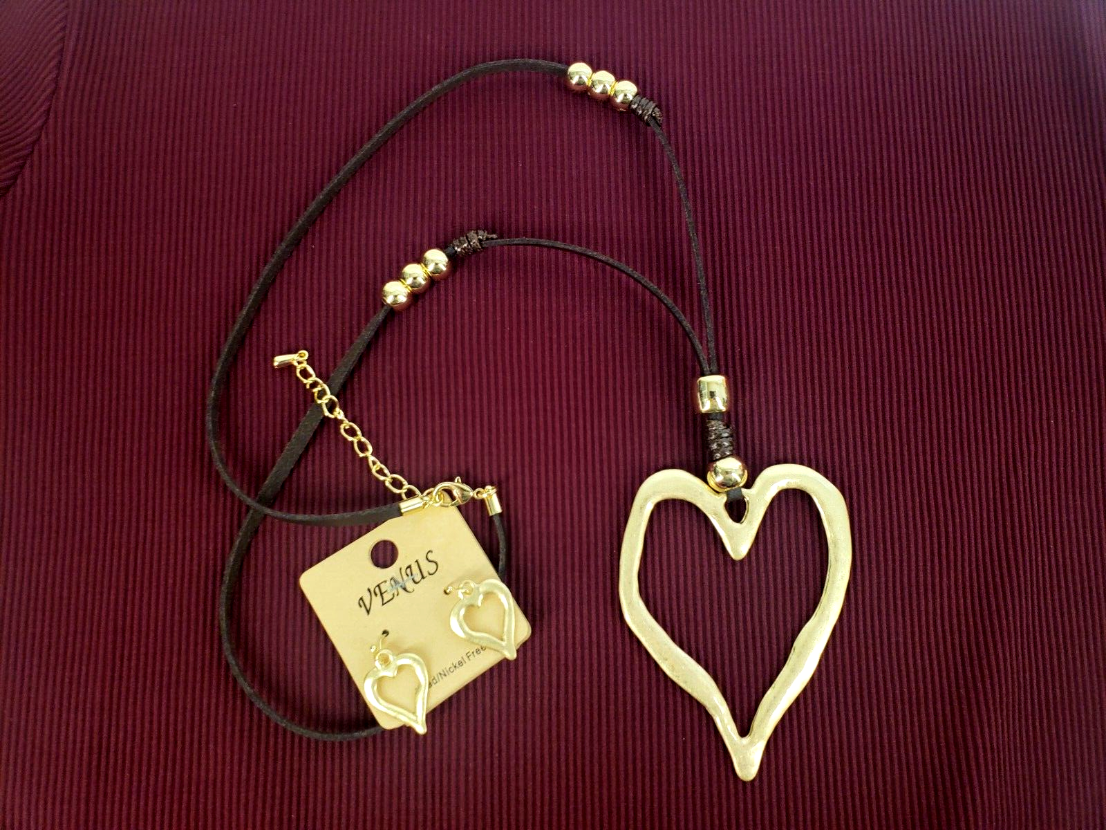 Golden Heart Charm Necklace and Earrings Set on Faux Leather with Venus Brand-image