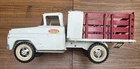 1963 or '64 white and red Tonka stake rack truck.  Beautiful  original example.