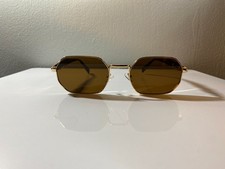 Gold framed, unisex sunglasses with brown polygonal lenses  tortoise shell arms