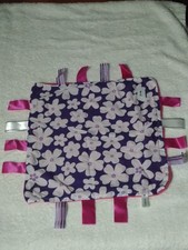 Handmade baby taggie comforter Purple and White flowers.