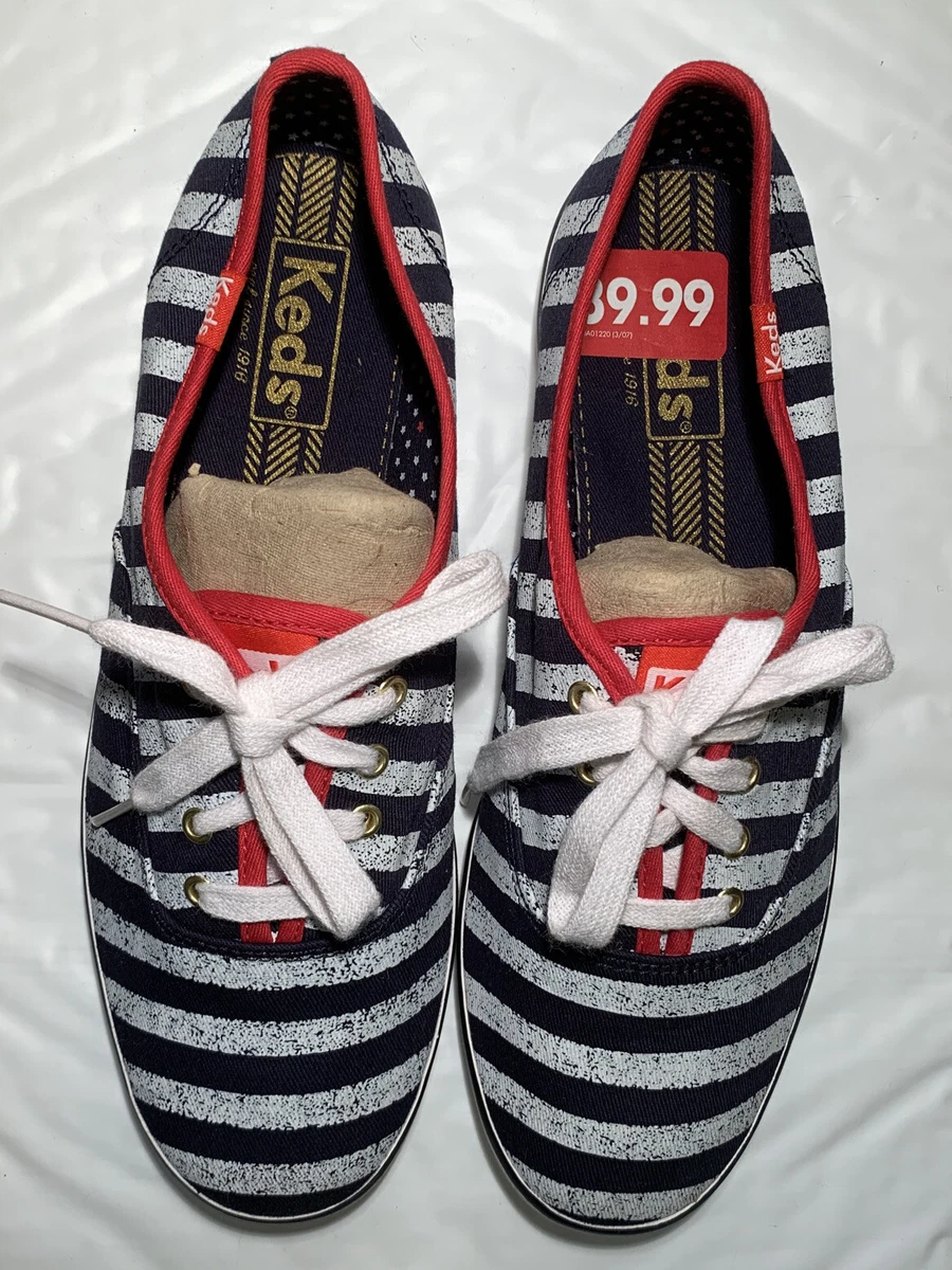 White keds with red cheap stripe
