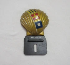 VINTAGE  1940'S-1950'S  SHELL  GASOLINE  INTERNATIONAL OIL LICENSE PLATE TOPPER