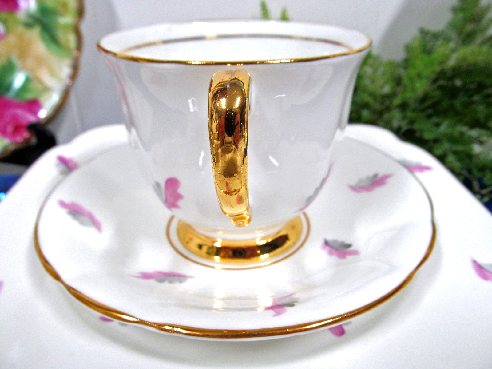 Clarence tea cup and saucer trio painted feather design pattern teacup England