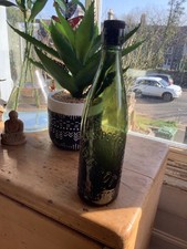 vintage collectible old green glass bottle with stopper