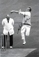 mike proctor south africa bowls a fast ball during the match signed 12x8 photo