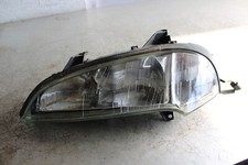 Opel Tigra A 1.6 16V  78 kW  Frontscheinwerfer links 1216523