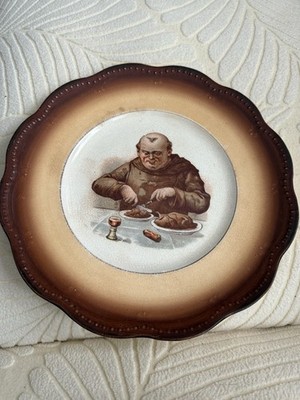 Edwin  M. Knowles. portly monk in traditional robes enjoying a hearty meal