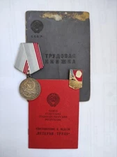 Medal "Veteran of labor" + badge + work book and award document for one person
