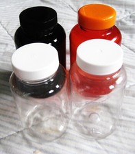 4 Reusable Plastic Bottles w Screw Top Lids 2 clear 4 1/2" orange 5" brown 5"