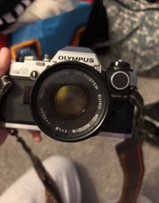 Olympus OM-10 35mm SLR Film Camera with 50 mm lens and Tiffen 49mm filter