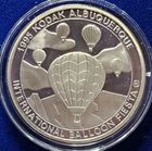 A 1995 ALBUQUERQUE INTERNATIONAL BALLOON FIESTA .999 SILVER COIN BOX COA
