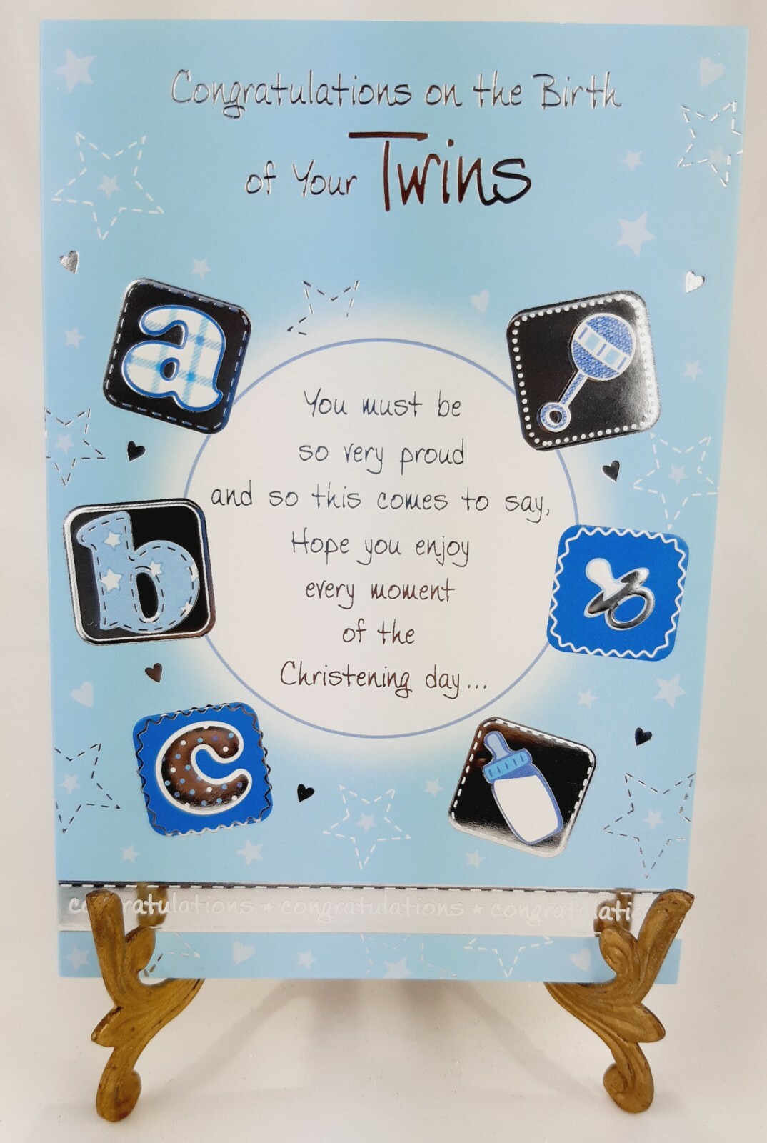 Eine Karte für die Geburt Ihrer Zwillinge in blau mit silbernen Text und Prägung