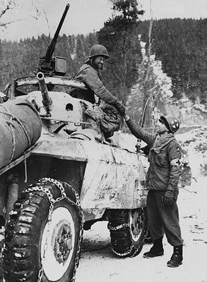 Corporal Ancel Casy shakes the hand of Private Alfred Gernhardt as- Old Photo