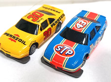TYCO TCR Nascars 30 Pennzoil and 43 STP with TCR wide chassis. READY TO RUN