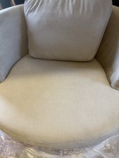 Orca  large cream swivel round chair and smaller arm chair from DFS