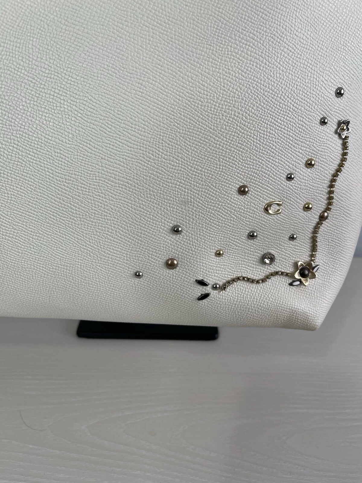 Borsa Coach City con zip e rivetti in cristallo polvere di stelle