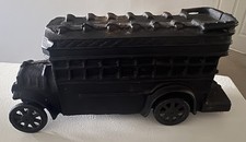 Cast iron toy double-decker bus with red wheels