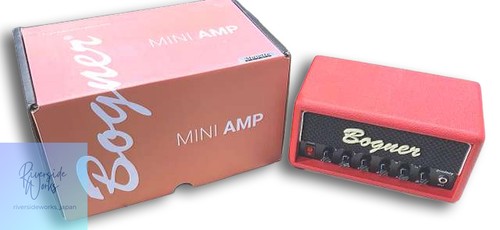 Red BOGNER Mini Amp with black control panel, silver corner protectors, and branded box showing “BOOGER” text.