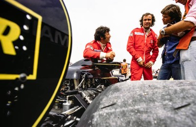 Gunnar Nilsson and Mario Andretti consult with their team British - Old Photo
