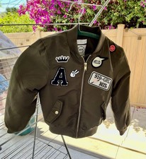 H M Kids Olive Green Bomber Jacket with Patches tagged 6-9 yr