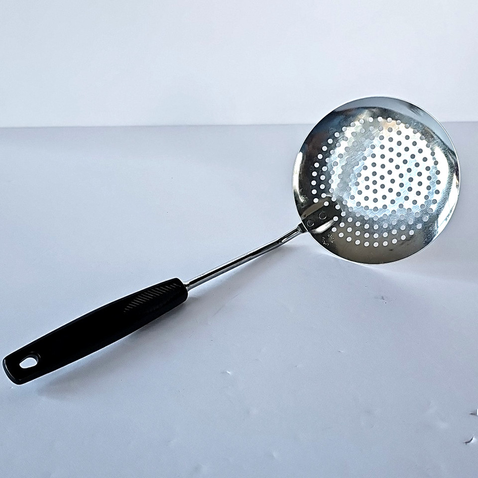 A classic Foley USA chrome skimmer with a sleek black bakelite-style handle — the kind of well-made American kitchen tool that puts modern cheapies to shame.