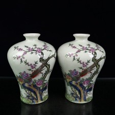 A pair of pink flower and bird patterned plum vases