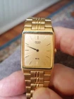 Vintage 1991 Seiko SX Tank Quartz Watch V701-5G20 Gold Tone Dress Tank Band Runs