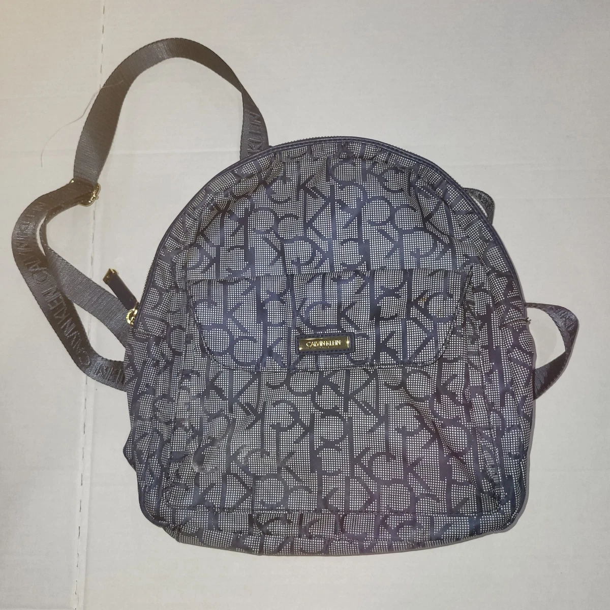 calvin klein mini purse backpack Women's Elaine Signature Key Item Flap Backpack, Brown/Khaki/Luggage Saffiano, One Size this backpack by Calvin Klein elevates hands Calvin Klein Garnet Backpack, Black