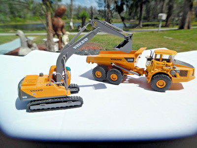 Volvo EC210 Digger Excavator crawler HO & A40D Articulated Dump Truck